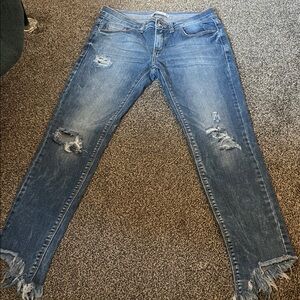 Distressed Women's Blue Denim Jeans